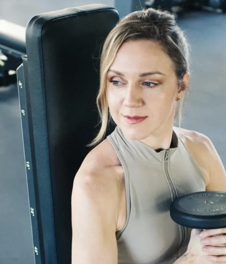 Ana training with weights — she trains the way she coaches her patients to